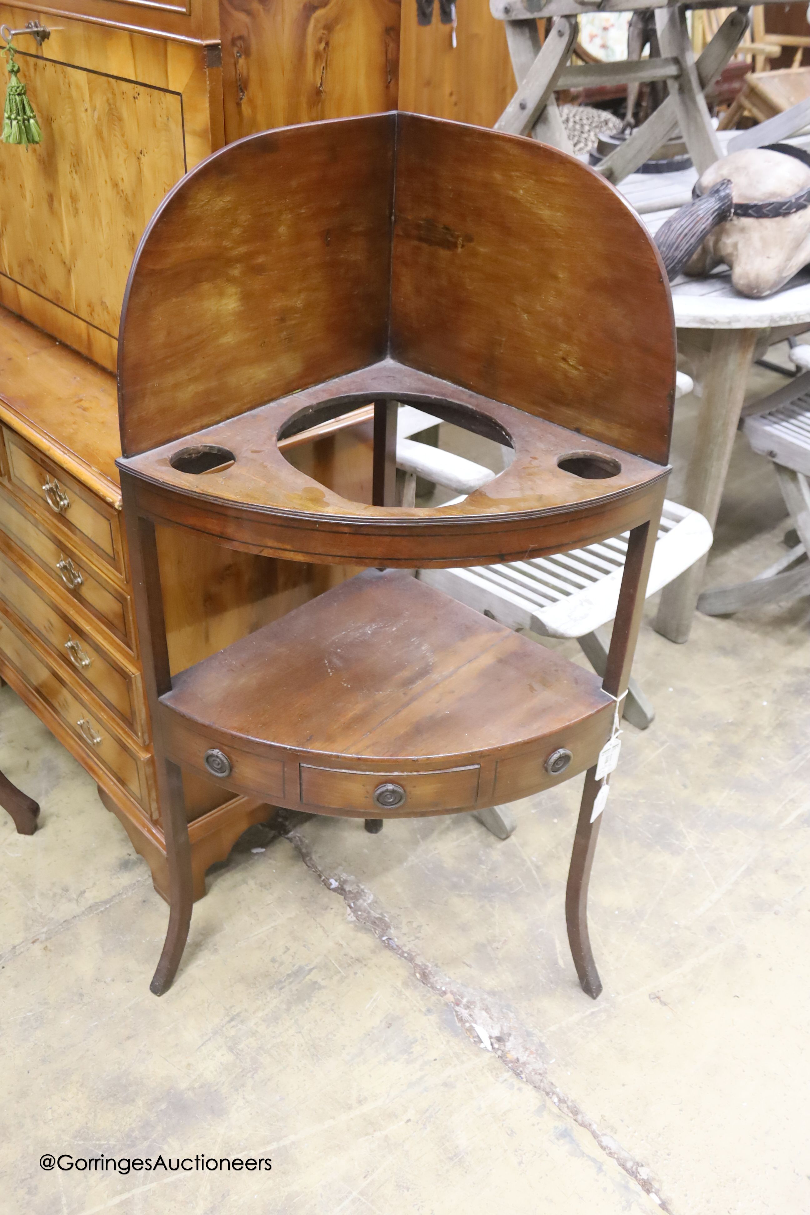 A George III mahogany bow front two tier corner wash stand, width 57cm, depth 39cm, height 110cm